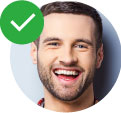 Man smiling and laughing with green checkmark